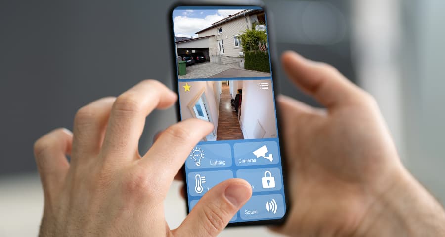Person checking video camera footage on a cell phone
