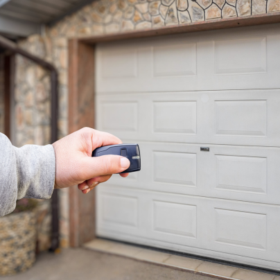 Cincinnati security key fob pointing to a garage door